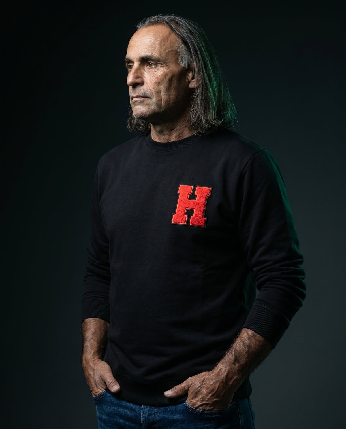 Pino editorial portrait wearing Chenille H sweatshirt